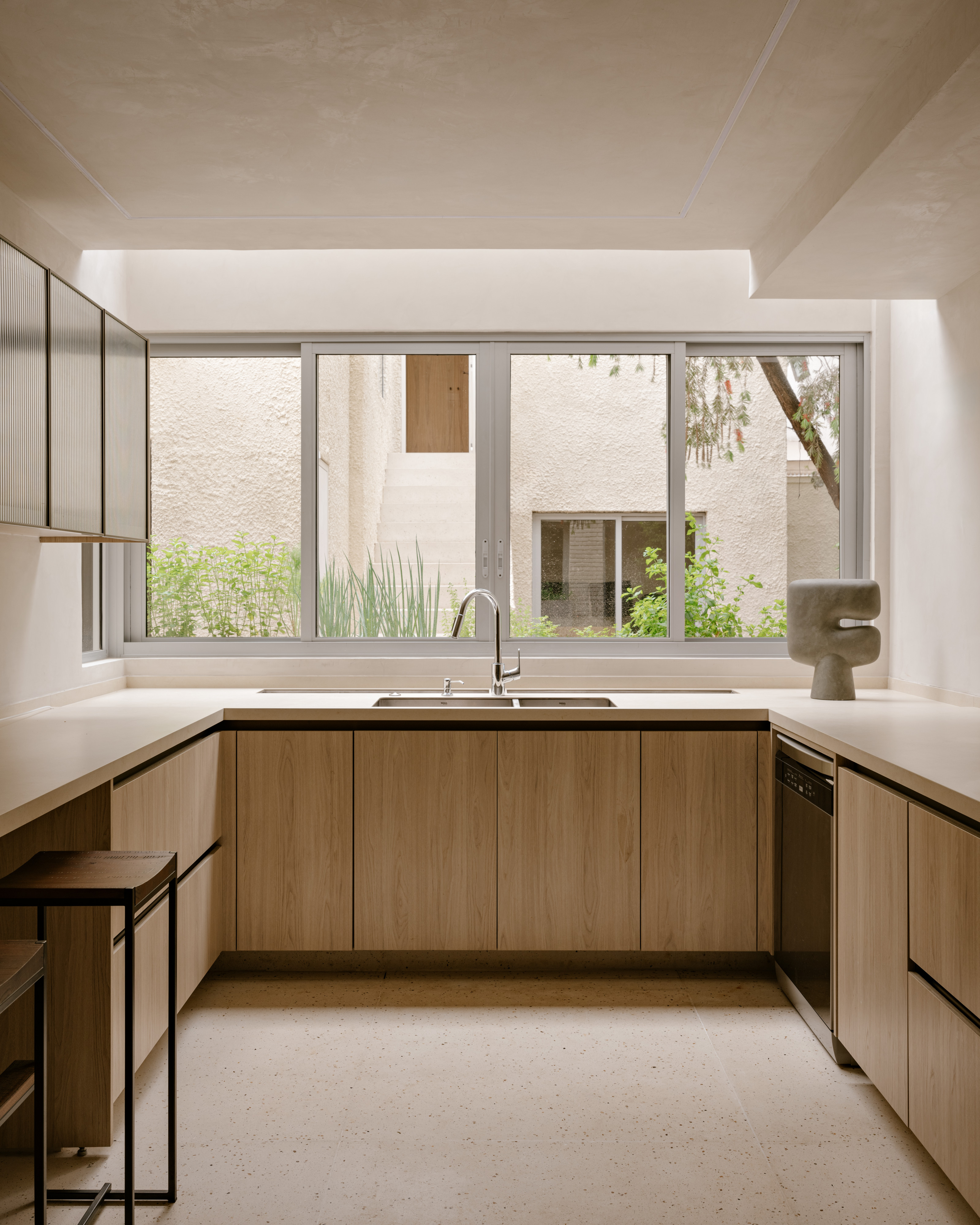The kitchen overlooks the rear annexe and courtyard garden