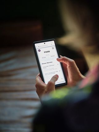 person using a menu on their phone