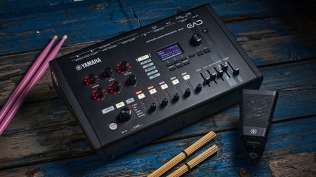 Yamaha EAD50 on a blue wooden floor surrounded by drumsticks