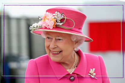 The late Queen Elizabeth II in a bright pink coat and hat