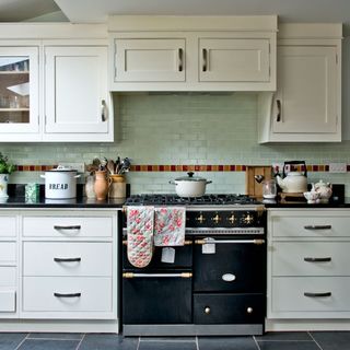 kitchen with pale green wall tiles
