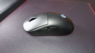 A Logitech G Pro wirless gaming mouse on a mouse pad