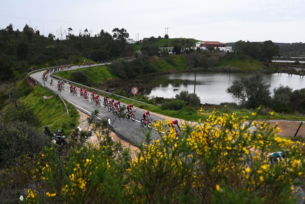 LAGOS PORTUGAL FEBRUARY 15 Michal Kwiatkowski of Poland and Team INEOS Grenadiers and a general view of the peloton competing during the 49th Volta ao Algarve em Bicicleta 2023 Stage 1 a 2002km stage from Portimo to Lagos VAlgarve2023 on February 15 2023 in Lagos Portugal Photo by Tim de WaeleGetty Images
