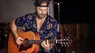 Kip Moore with Gibson acoustic guitar