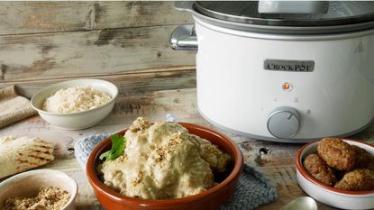 Best slow cooker Crock-Pot with a finished serving of dumplings and sauce