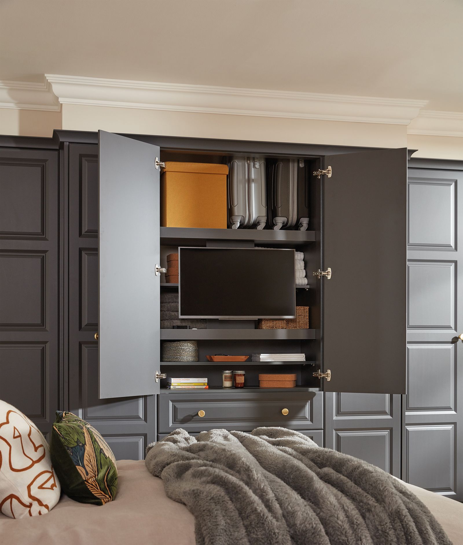 Where to put a TV in a bedroom? Here's how to minimize its presence