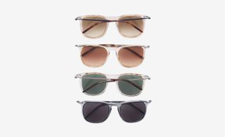View of four pairs of Tomas Maier sunglasses in different colours pictured against a light grey background