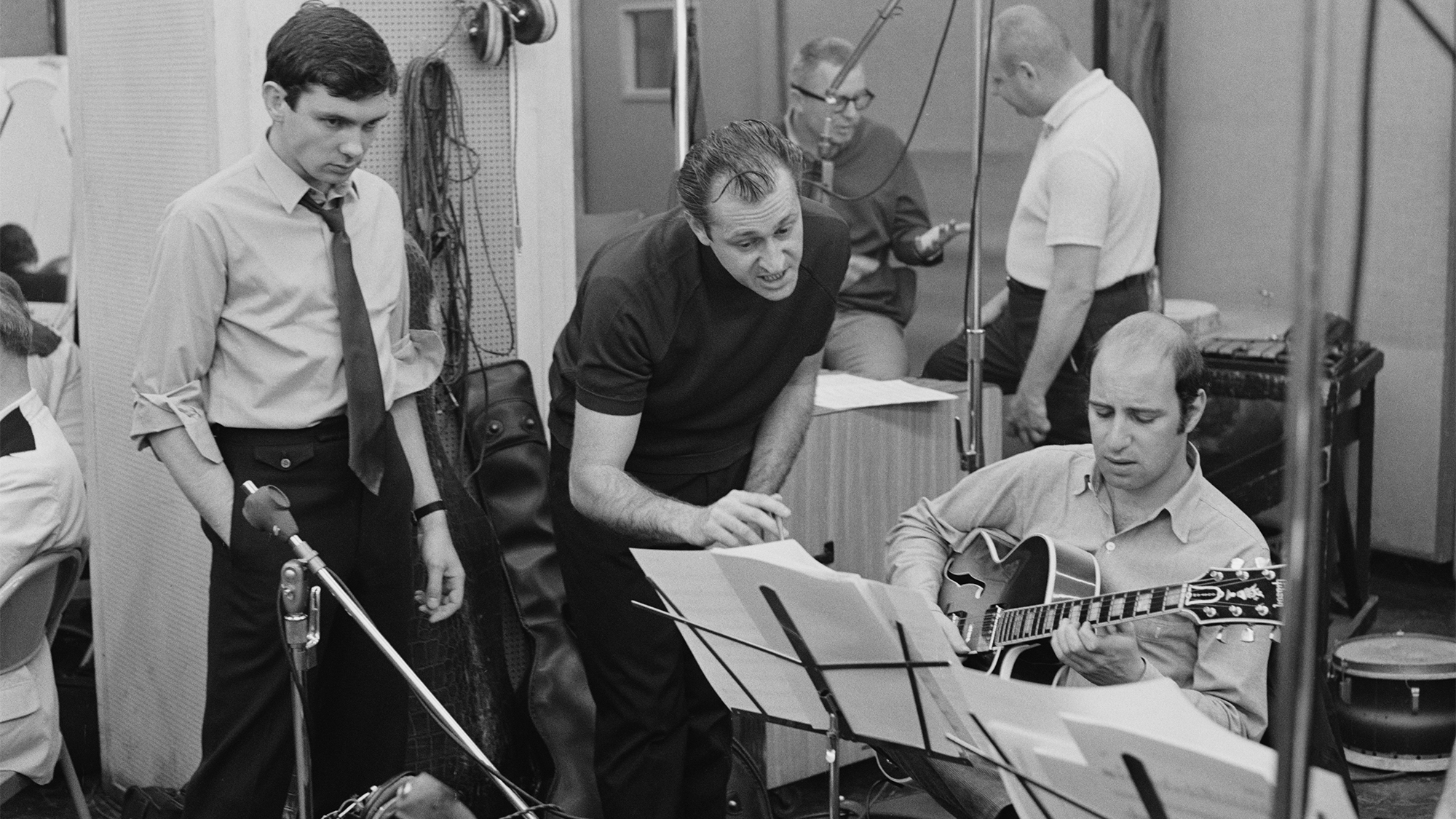 From left to right, American singer-songwriter and musician Gene Pitney (1940 - 2006) with music arranger Gary Sherman and session guitarist Al Gorgoni in a recording studio, circa 1965.