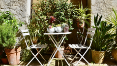 Provence patio seating area with terracotta plants