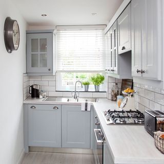 kitchen with blue cabinets and worktop