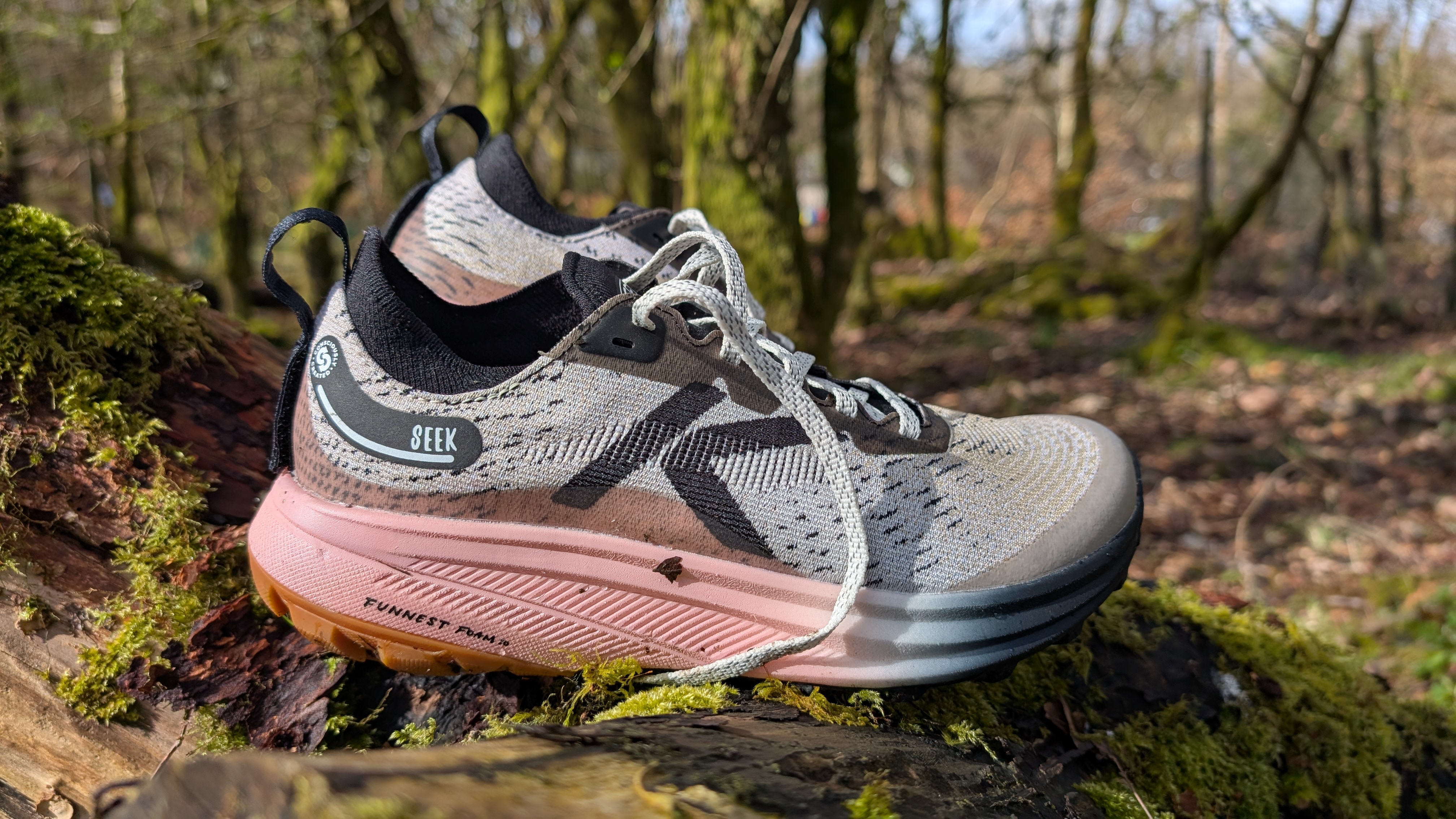 A Keen Seek trail running shoe in the forest