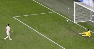 Sergio Busquets, left, misses Spain's first penalty against Switzerland