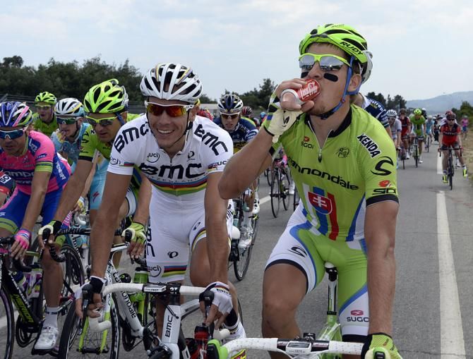 Peter Sagan (Cannondale) chugs a Coke