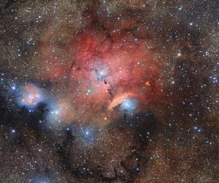 The OmegaCAM imager on ESO's VLT Survey Telescope captured this brilliant view of Sharpless 29, a stellar nursery. Many astronomical physical phenomena can be seen in this giant image, including clouds of cosmic dust and gas that reflect, absorb and re-emit the light of hot young stars within the nebula.