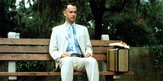 Forrest Gump sitting alone on a bench in the park.