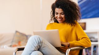 woman using a laptop with antivirus