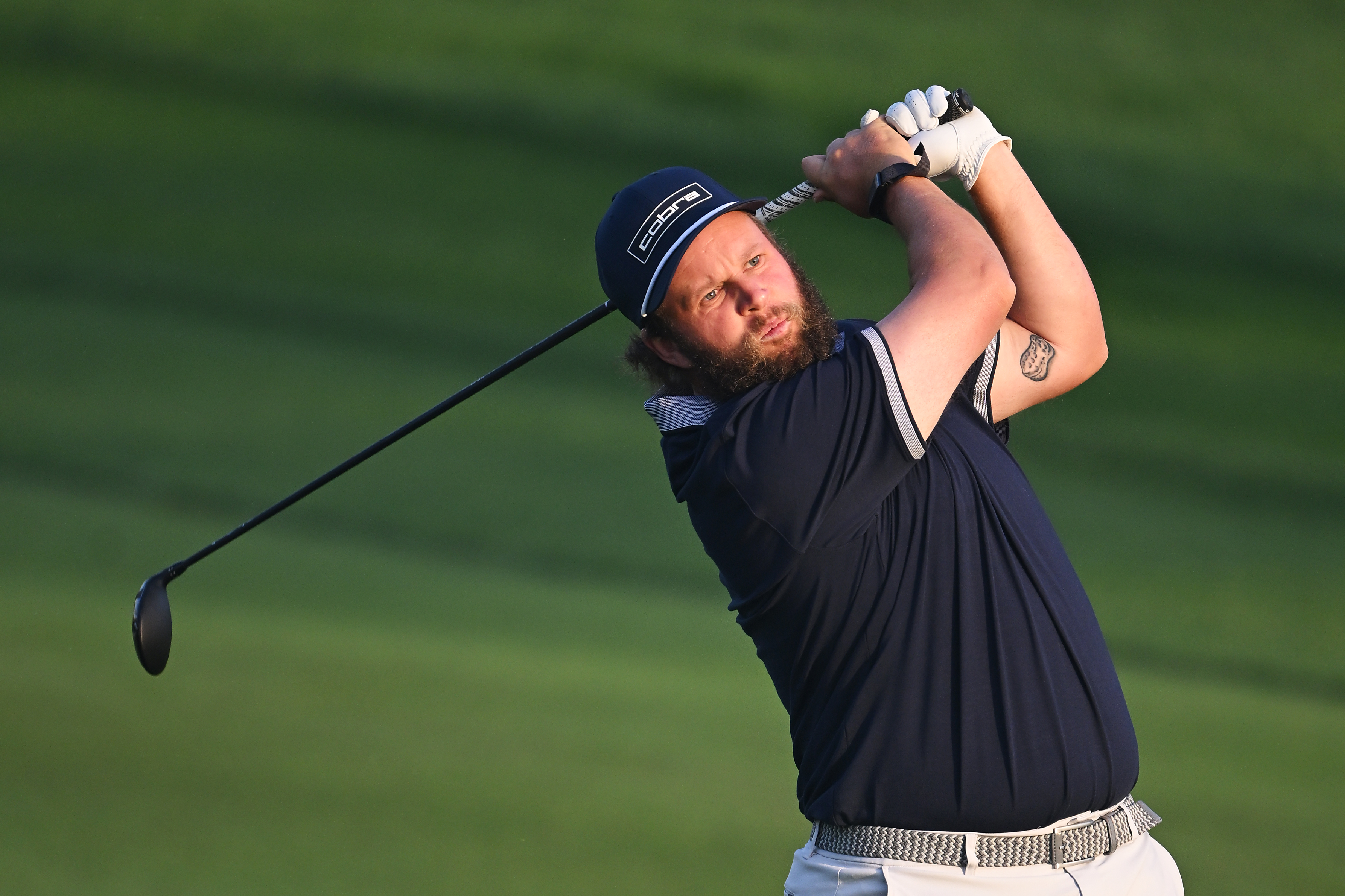 Andrew Johnston holds his finish on a fairway wood shot