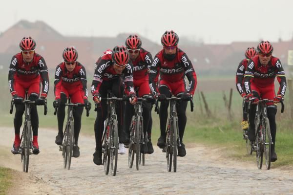 The BMC riders look for the best line through the cobbles