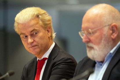 THE HAGUE NETHERLANDS NOVEMBER 24 Geert Wilders L Dutch rightwing politician and leader of the Party for Freedom PVV sits next to Frans Timmermans leader of the GroenLinksPvdA alliance during a meeting in the Dutch parliament with party leaders to discuss the formation of a coalition government following Wilders victory in Wednesdays general election on November 24 2023 in The Hague Netherlands The Netherlands rightwing antiEU leader Geert Wilders won the most votes in parliamentary elections on November 22 and will now face the countrys political parties to form a government Photo by Carl CourtGetty Images