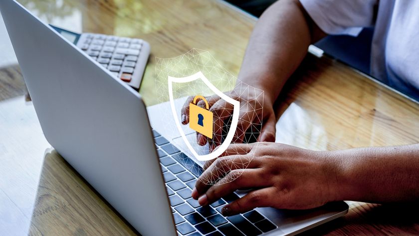 Hands typing on a laptop computer with a lock icon