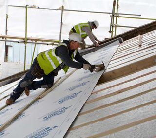 On new build or replacement pitched roofs, the ideal build up would be insulation fitted over and then between the rafters — giving a big boost for airtightness