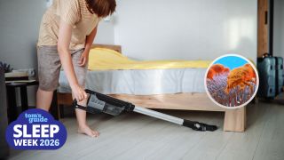 A woman with short brown hair vacuums under her bed because an allergist said it's a hidden dust trap that could be trigging her 3 a.m. wake-ups