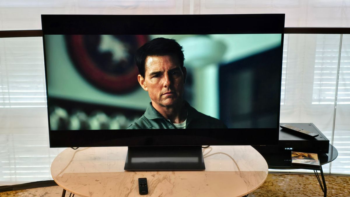 Samsung S90D 48-inch TV on a marble table with Top Gun Maverick playing on screen 