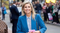 Queen Máxima of The Netherlands wears a blue suit as she visits the Dutch Design Week on October 26, 2023 in Eindhoven, Netherlands. 