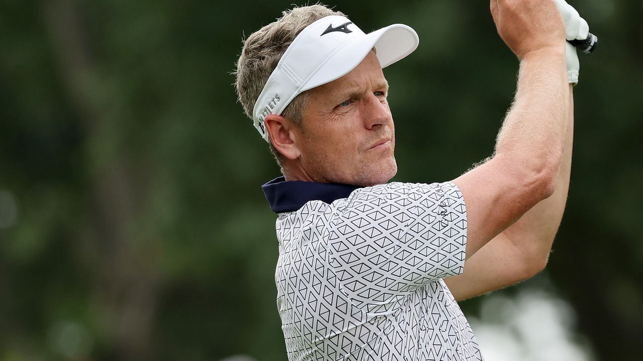 Luke Donald hits a golf shot