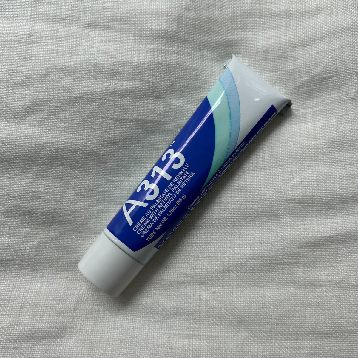 The A313 retinol on a white linen background