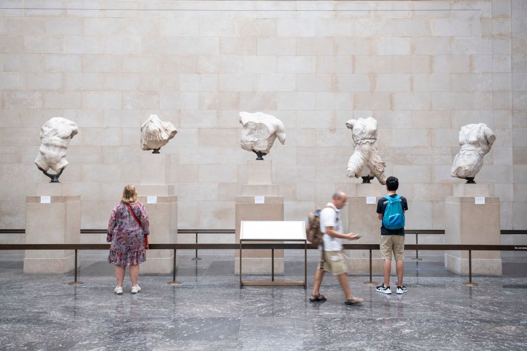 Tourists visit the Elgin Marbles at the British Museum in London