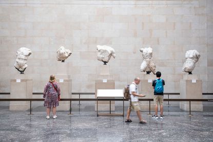 Tourists visit the Elgin Marbles at the British Museum in London