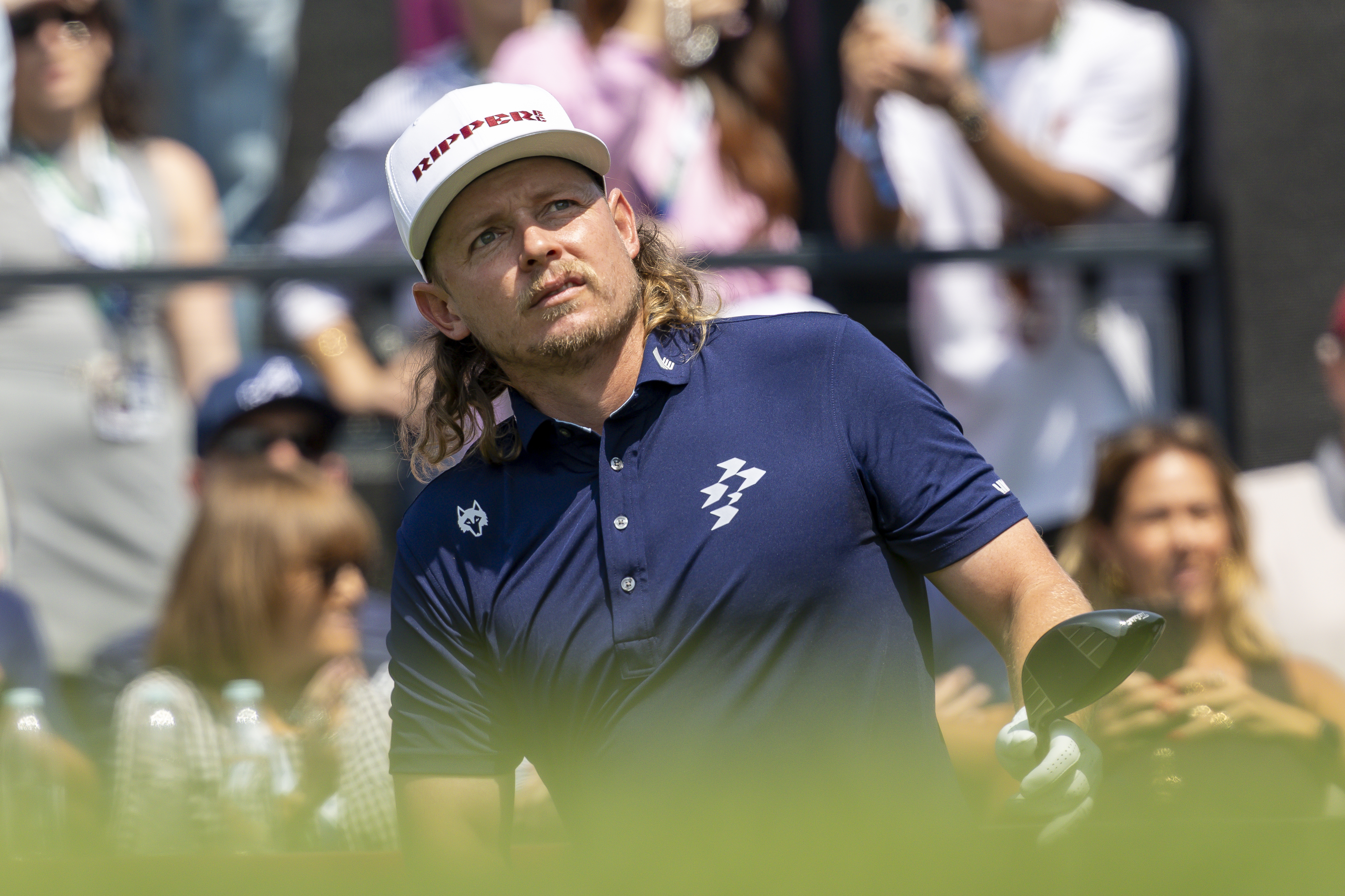 Cameron Smith watches his tee shot