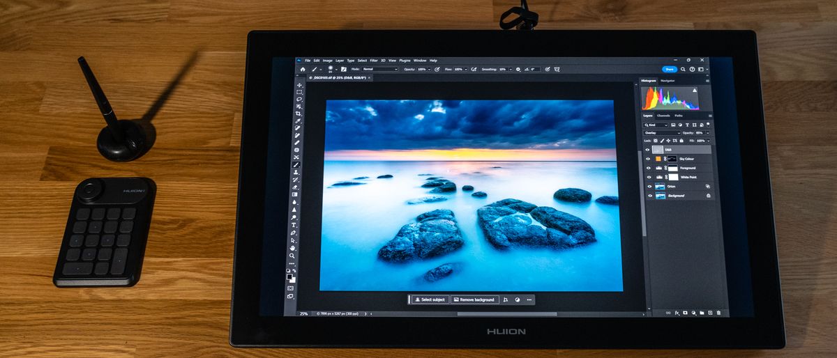 Huion Kamvas Pro 24 (4K) drawing tablet on a wooden surface