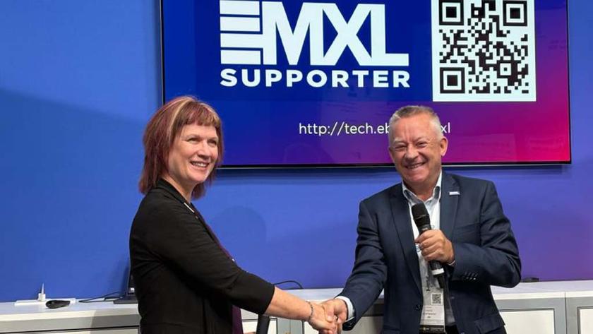 At IBC2025, The European Broadcast Union (EBU) announced a partnership with the Advanced Media Workflow Association (AMWA) to create the Joint Taskforce on Dynamic Media Facilities (JT-DMF). (L. to R.): Cindy Zuelsdorf, director, membership and marketing, AMWA; and Hans Hoffmann, deputy director, T&amp;I, EBU. 
