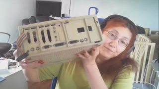 Rebecca Heineman holding Apple II computer