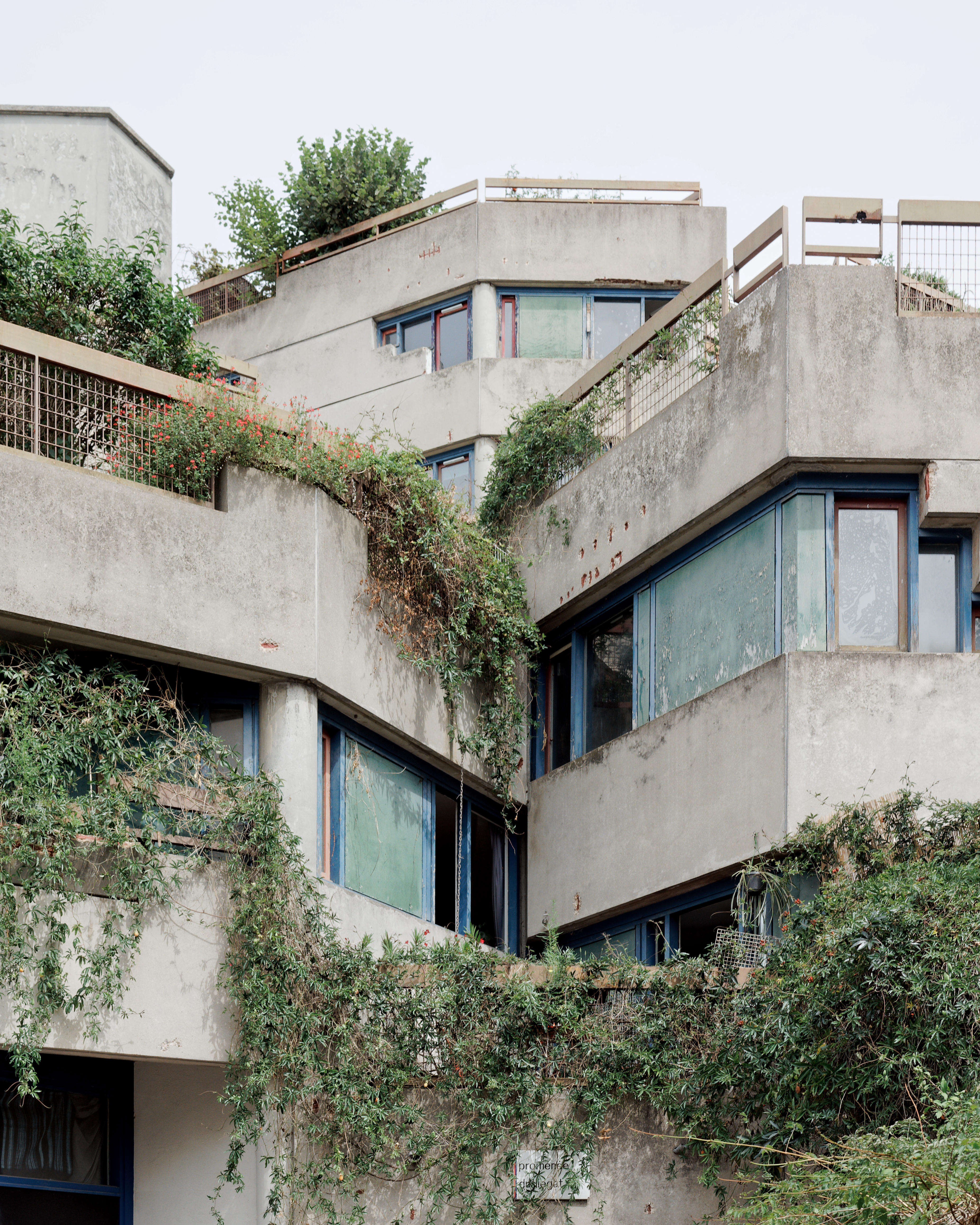 architect Rene&amp;#769;e Gailhoustet's work, Le Lie&amp;#769;gat, Ivry-sur-Seine, Paris, a concrete composition engulfed in greenery