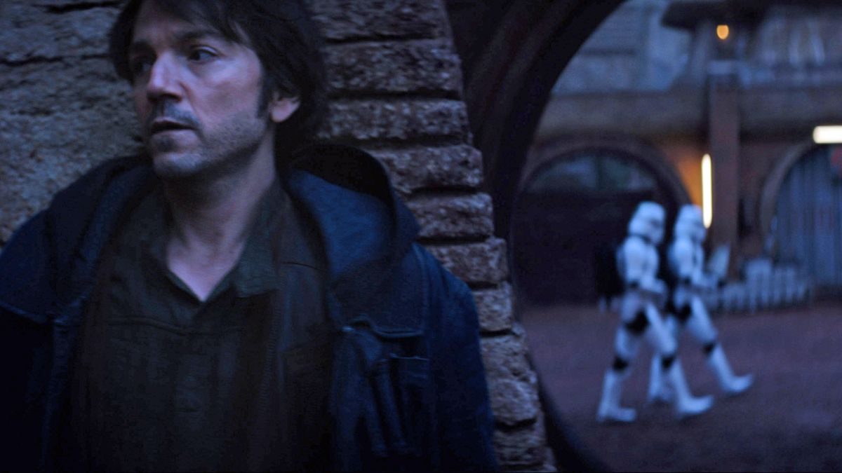 Diego Luna&#039;s Cassian Andor hides from a group of Clone Troopers in the Andor TV series