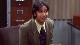 Raj sitting in a chair.