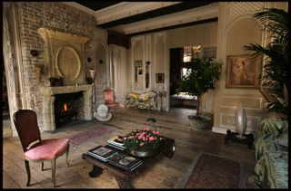 living room with antique fireplace and antique furniture