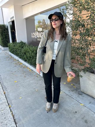 Allyson Payer wearing a green oversize blazer.