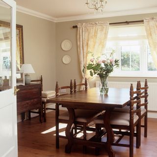 dinning room with white walls and wooden flooring