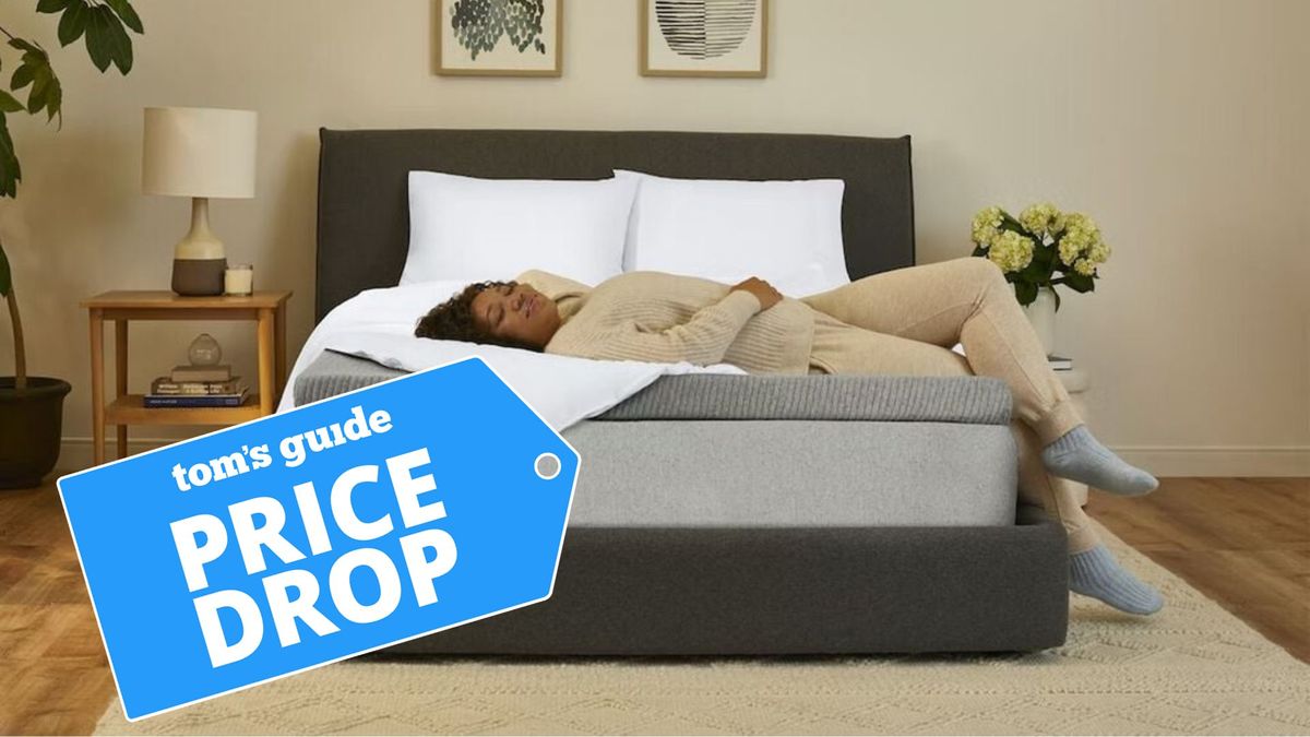 A woman relaxes on the Casper Comfy Mattress Topper