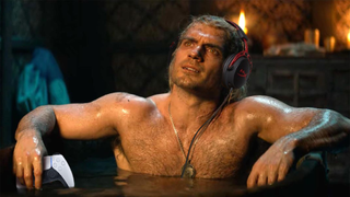 Geralt of Rivia relaxes in a bathtub with his PlayStation 5 controller and gaming headset