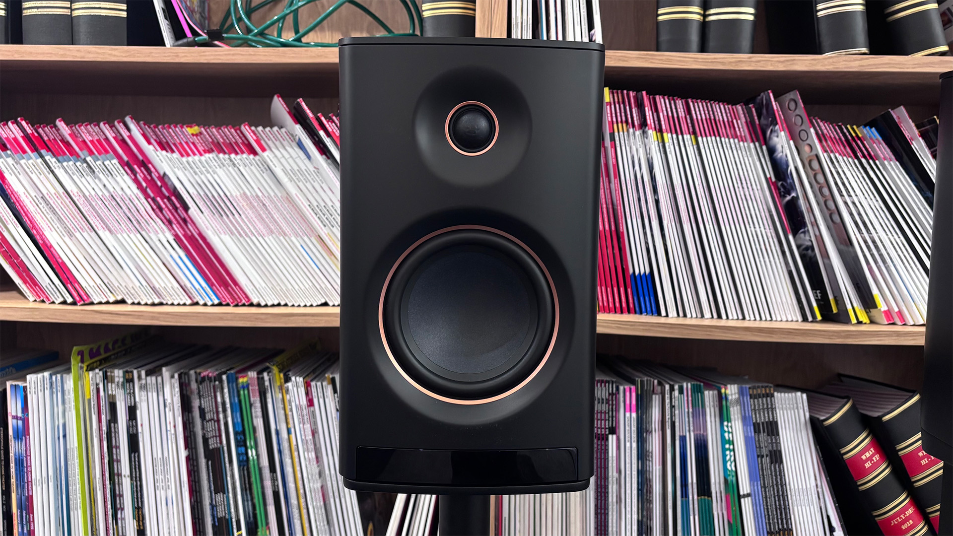 Yamaha NX-70A all-in-one system, one speaker in front of bookcase