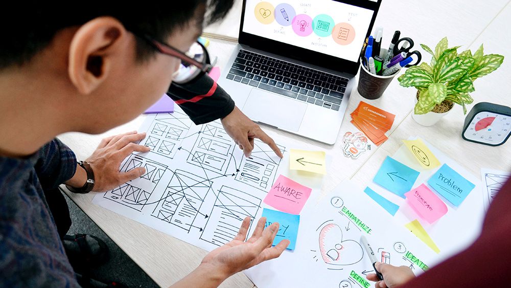 UX designers work on a UX design on a budget