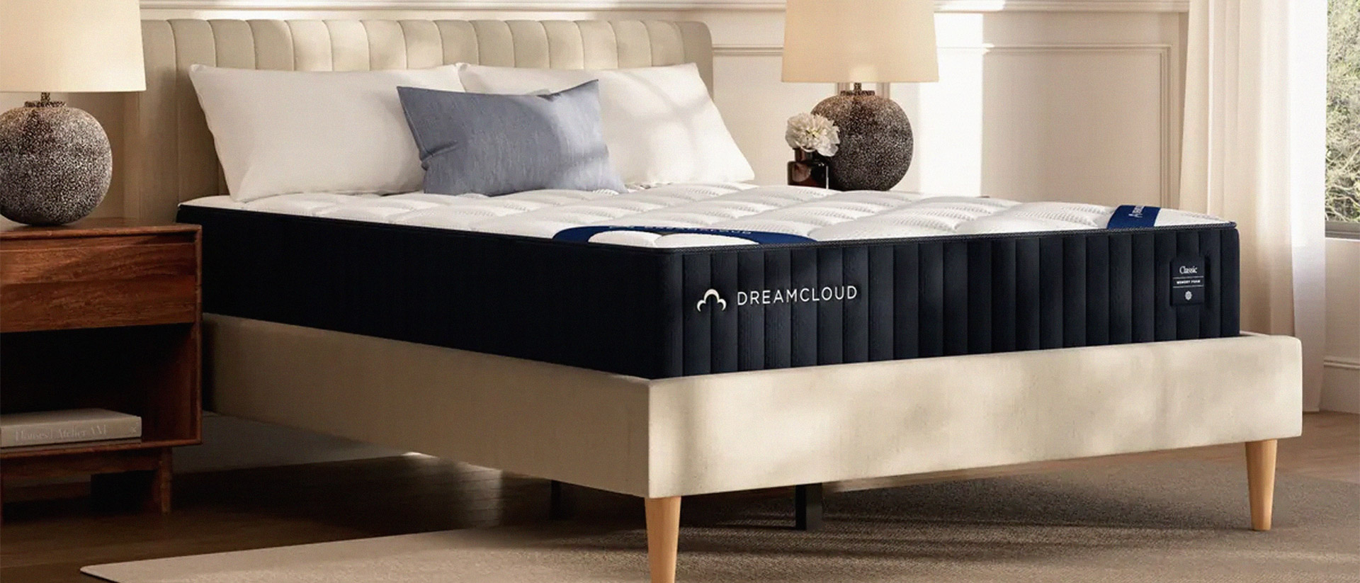 The DreamCloud Classic Memory Foam Mattress on a bed in a bedroom