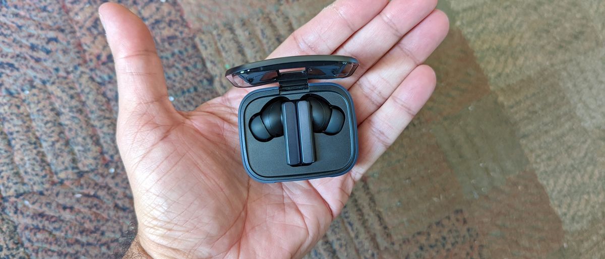 The EarFun Air Pro SV being held in hand