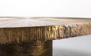 A golden metallic coffee table