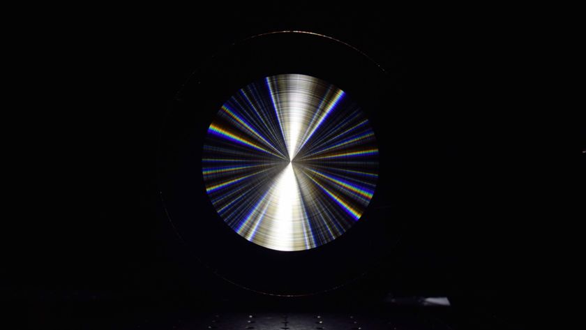 An image of a very reflective flat, silvery-looking lens. 